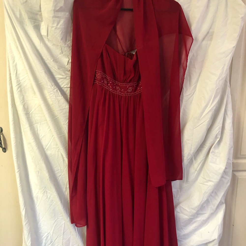 Long red David’s bridal dress with lace cover